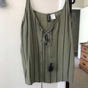 Green top with tassels